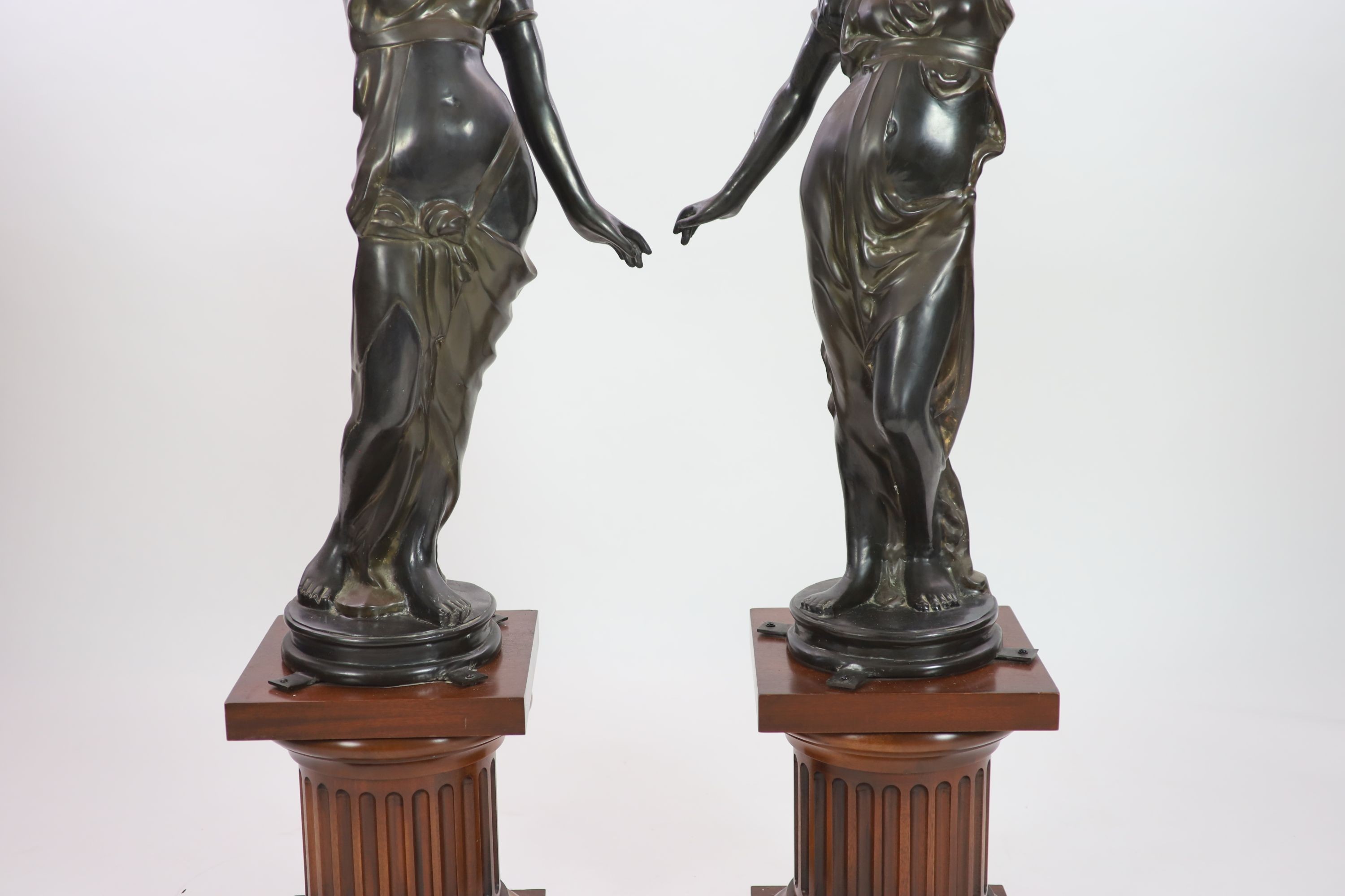 A pair of 19th century style bronze figural torcheres, overall H 192cm